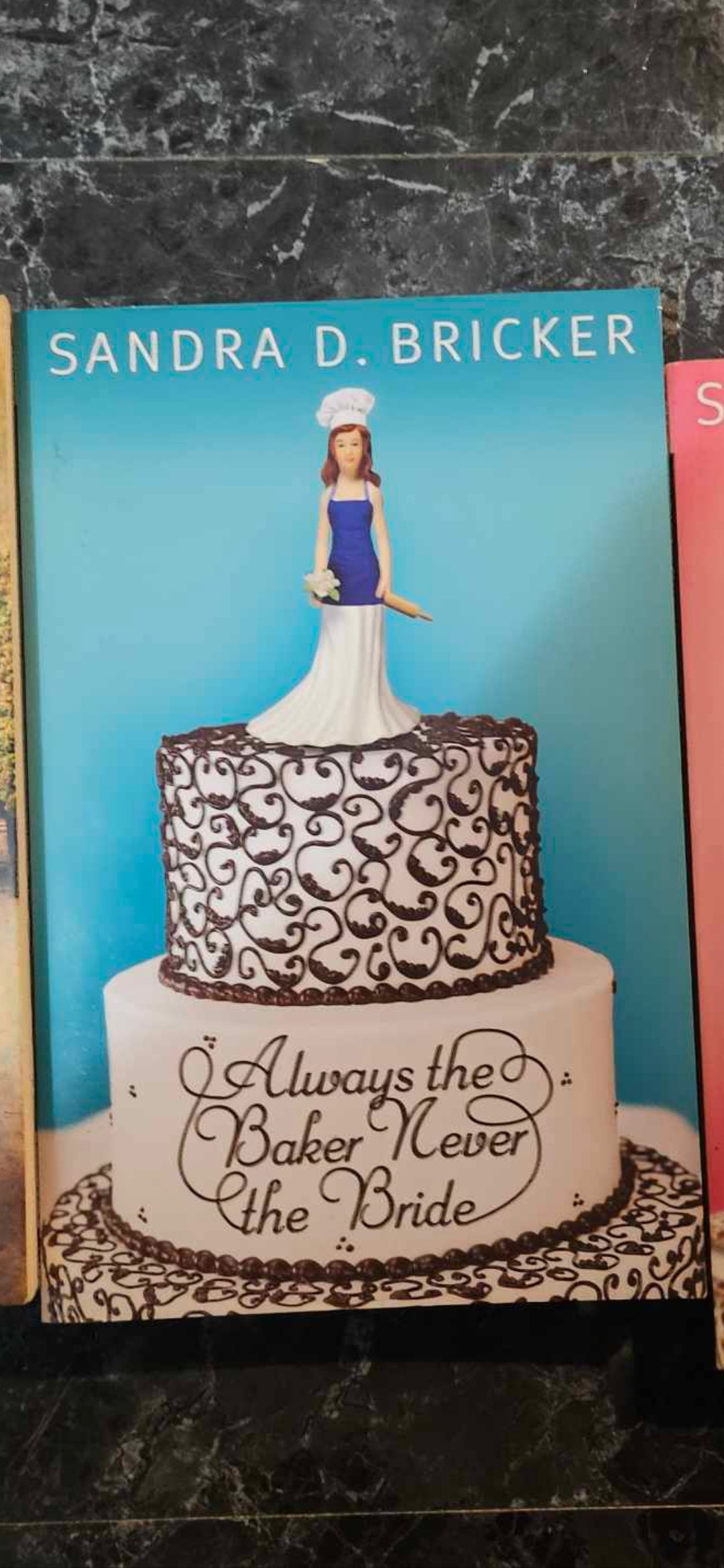 Always the Baker, Never the Bride
Novel By: Sandra Bricker